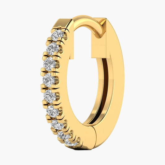 Gold hoop earring with embedded diamonds on a white background