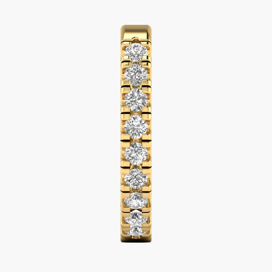 Gold earring with diamonds on a white background