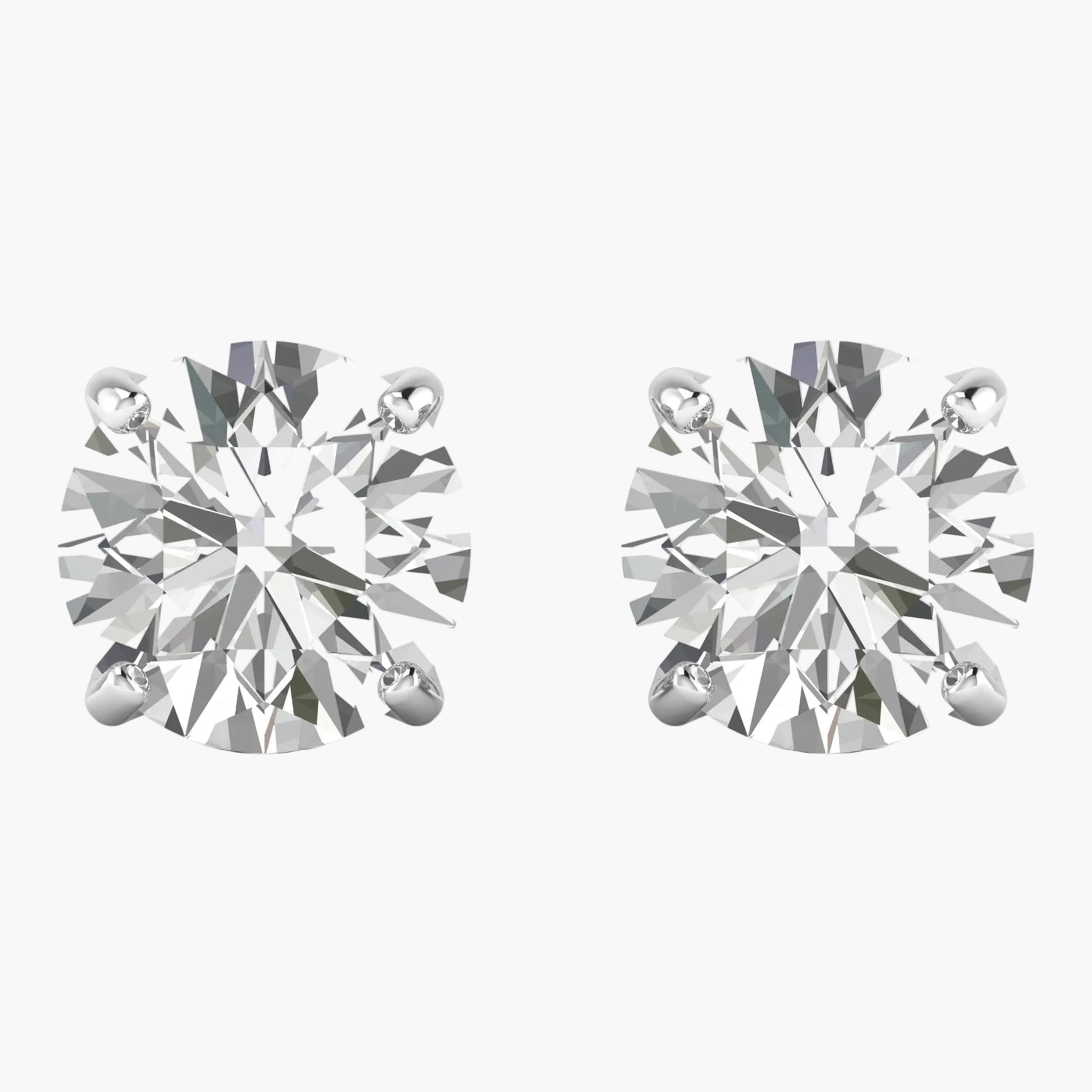 Pair of diamond stud earrings on a white background