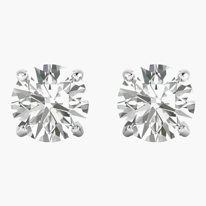 Pair of diamond stud earrings on a white background