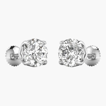 Pair of diamond stud earrings on a white background