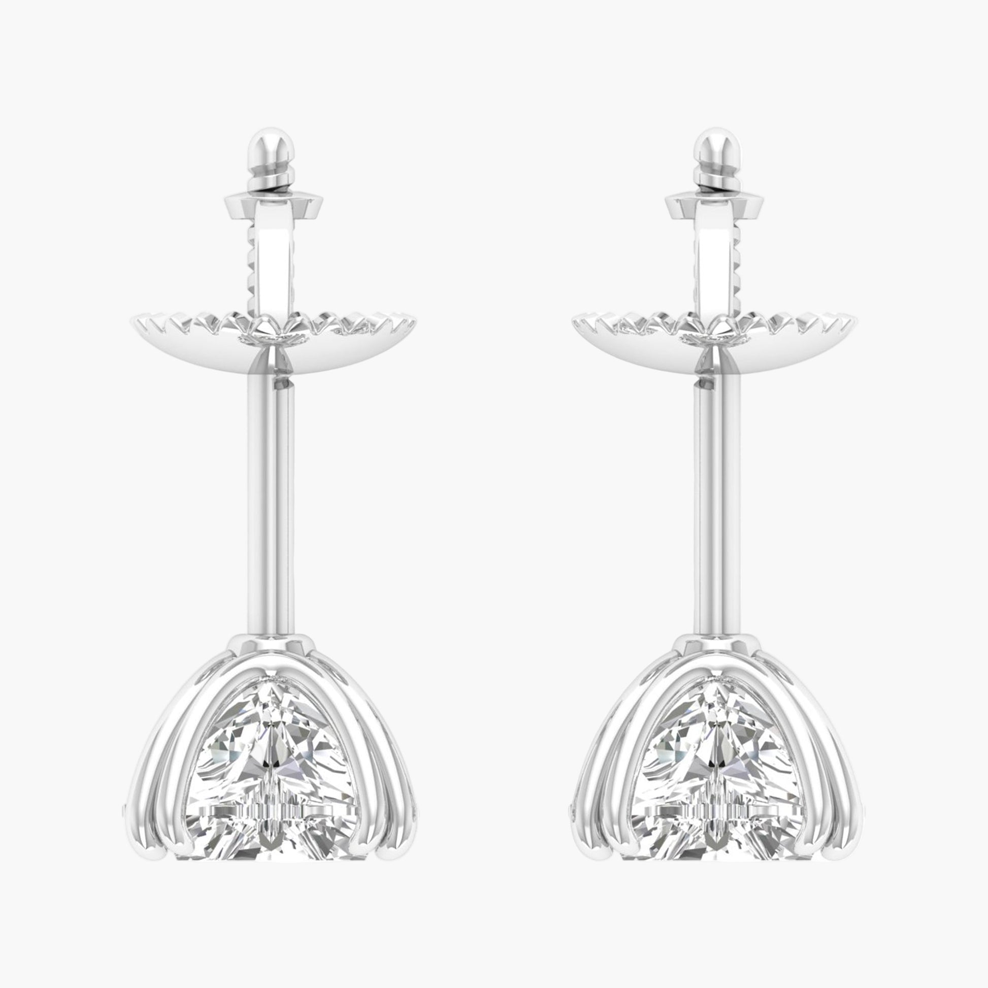 Pair of silver earrings with clear gemstones on a white background