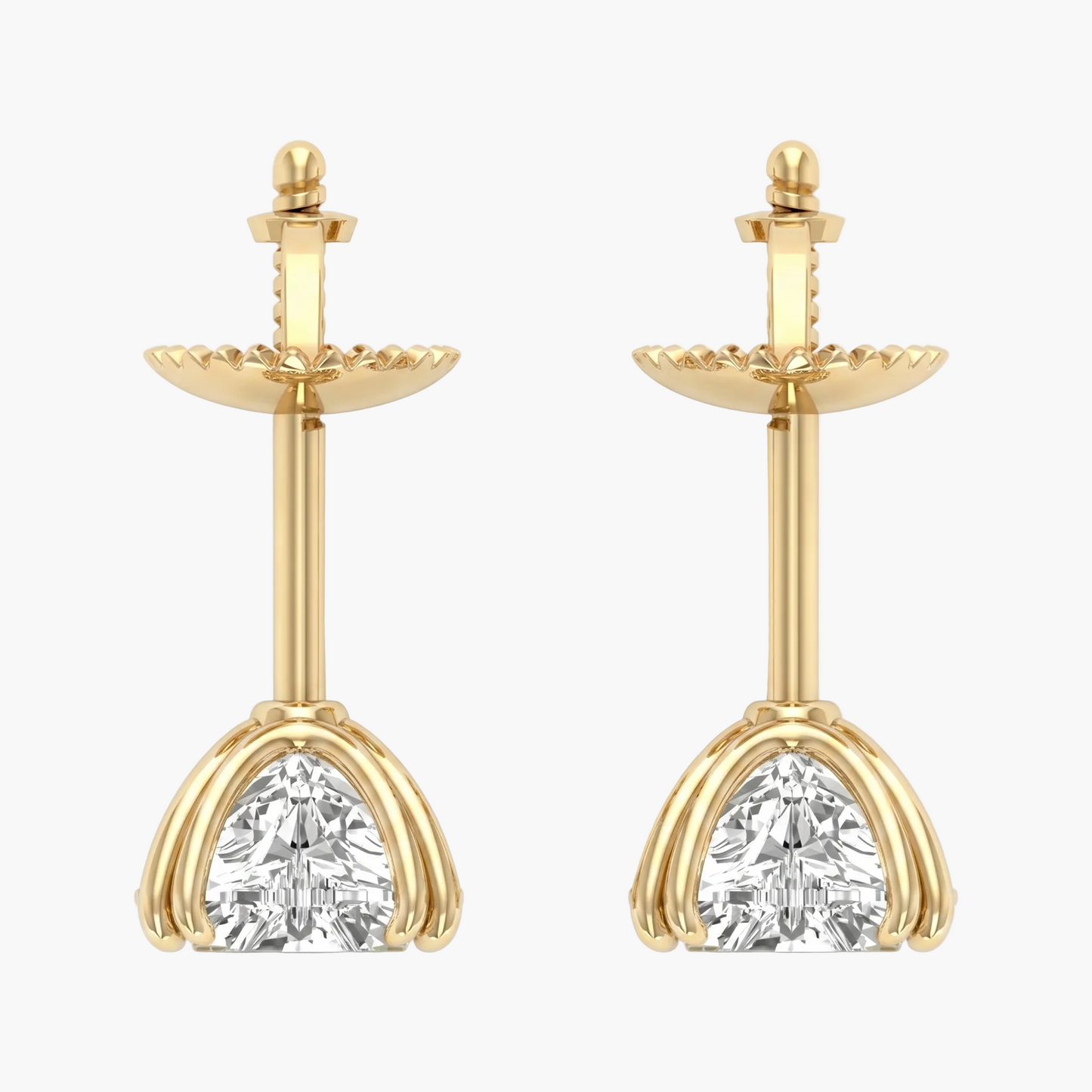 Gold earrings with clear gemstones on a white background