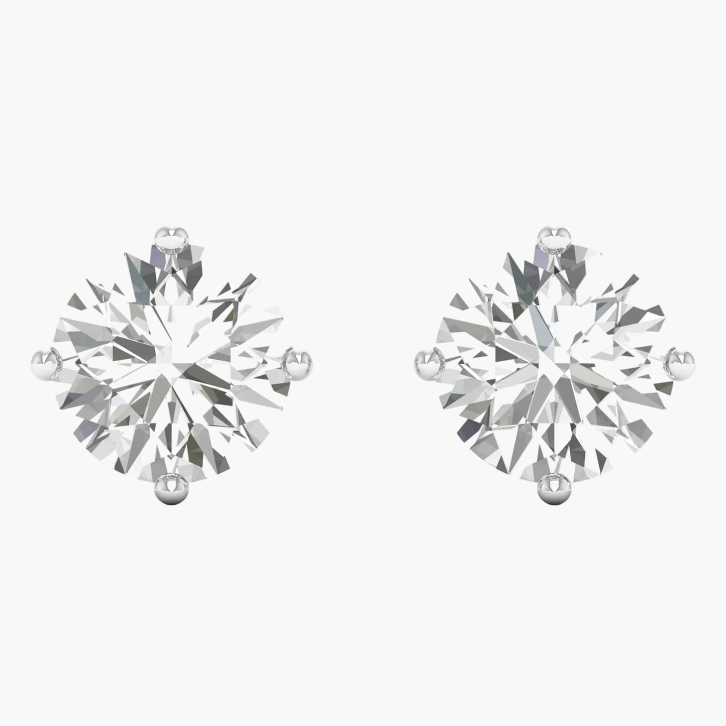 Pair of diamond stud earrings on a white background