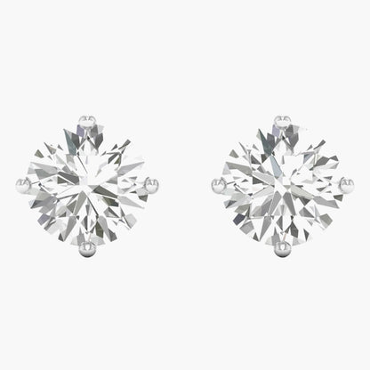Pair of diamond stud earrings on a white background