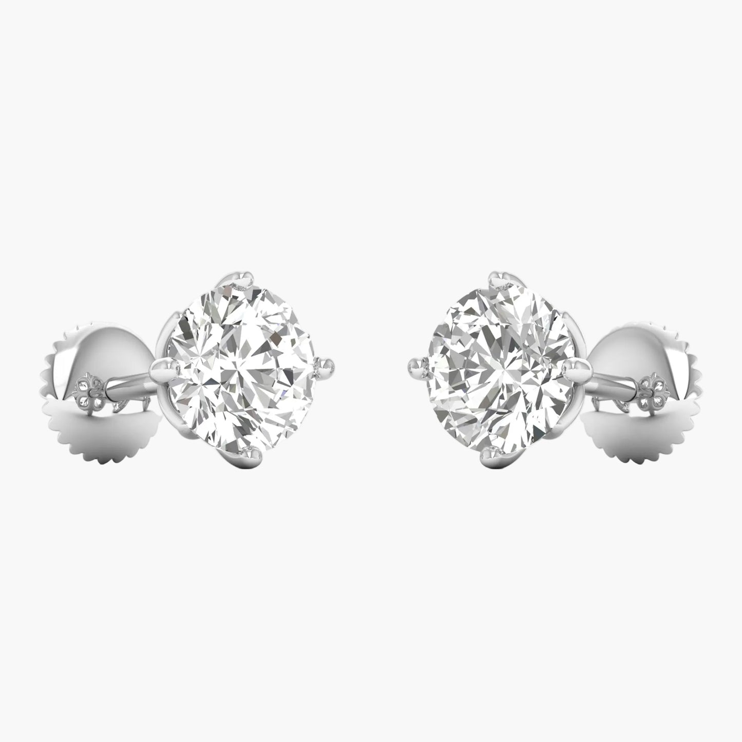 Pair of diamond stud earrings on a white background