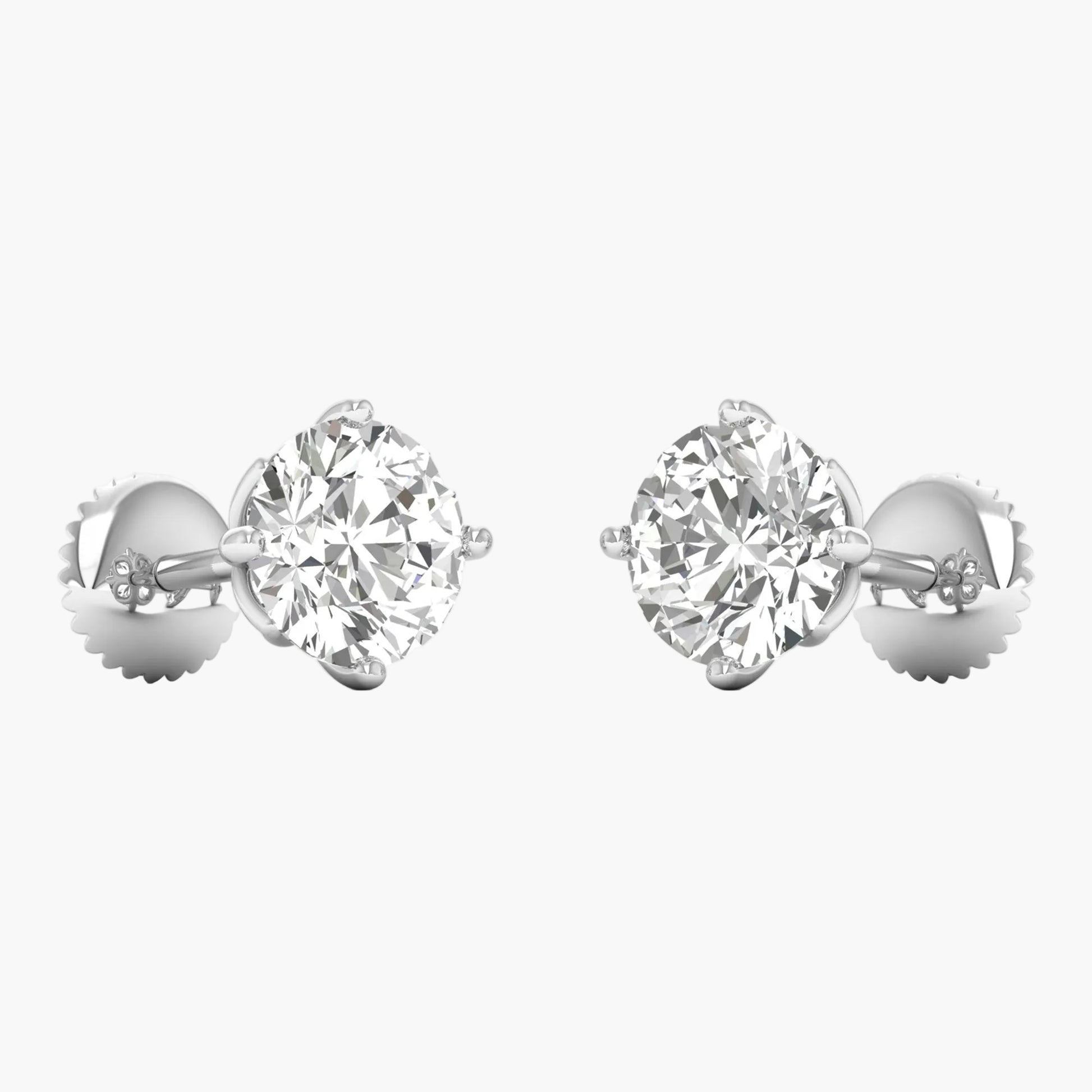 Pair of diamond stud earrings on a white background