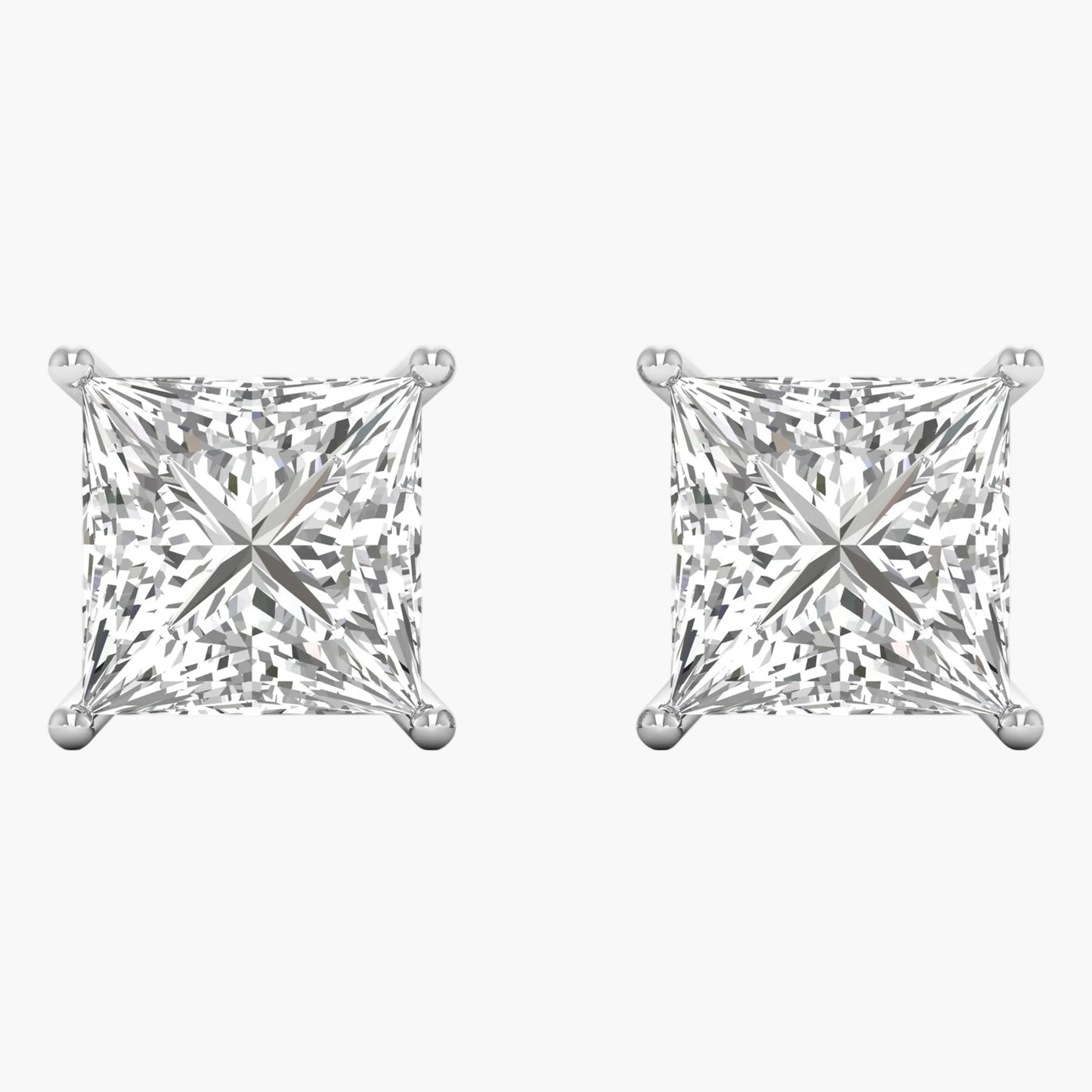 Pair of diamond stud earrings on a white background