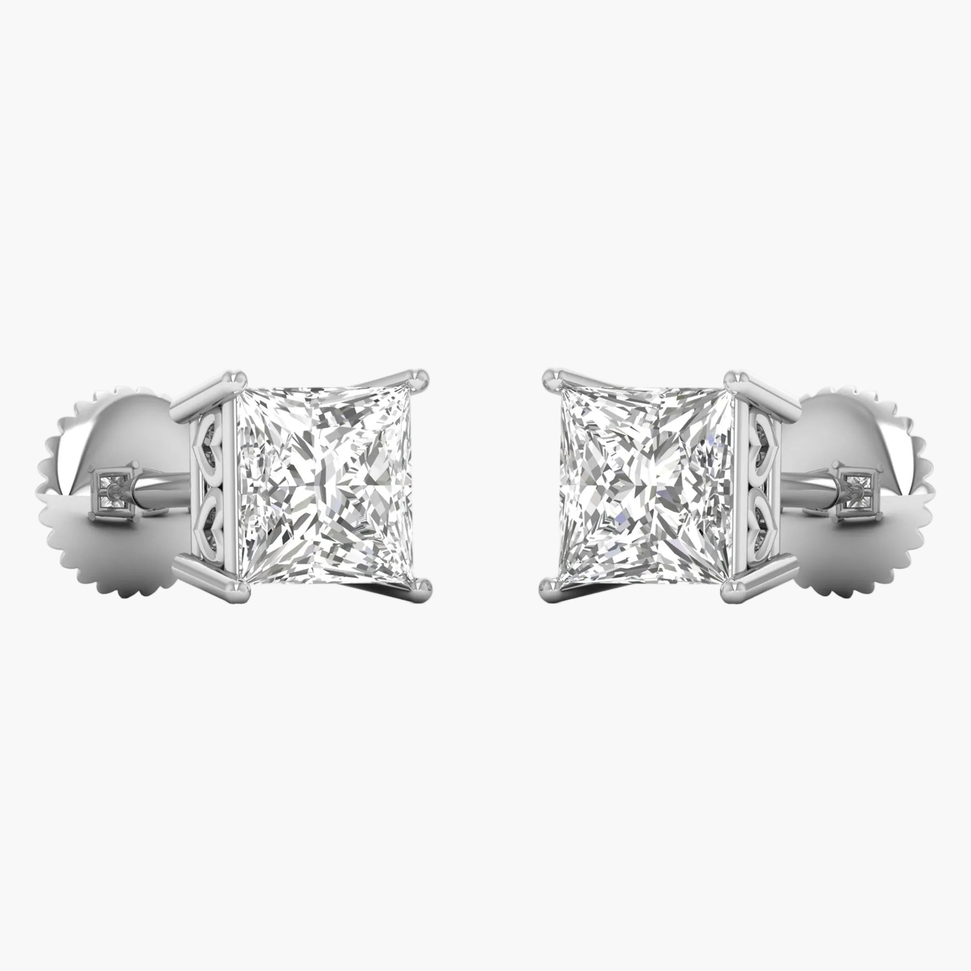 Pair of diamond stud earrings on a white background