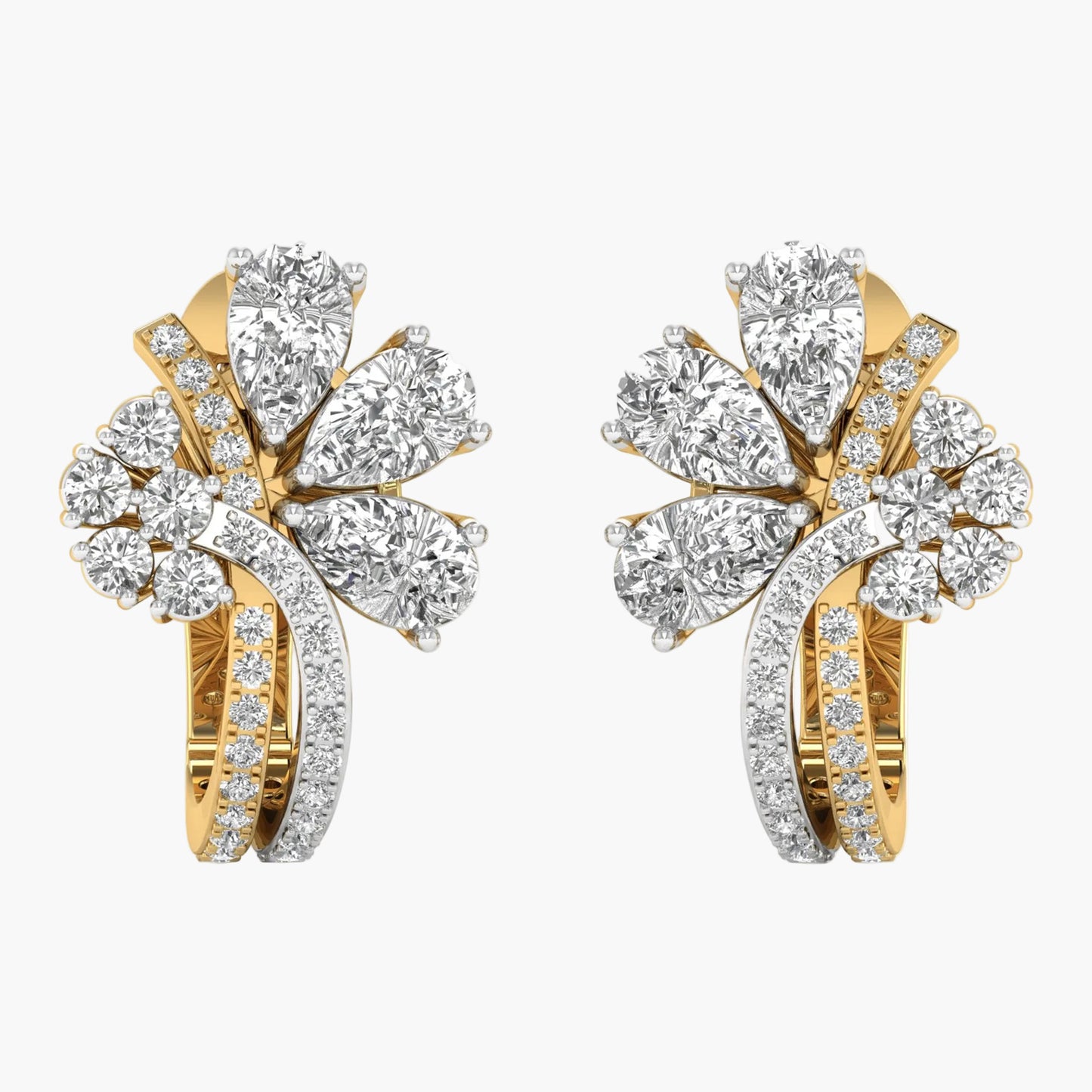 Pair of gold and diamond earrings on a white background