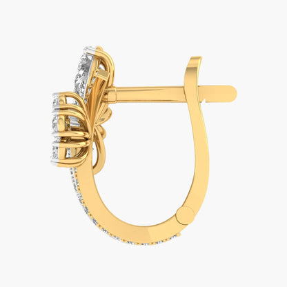 Gold earring with diamond accents on a white background