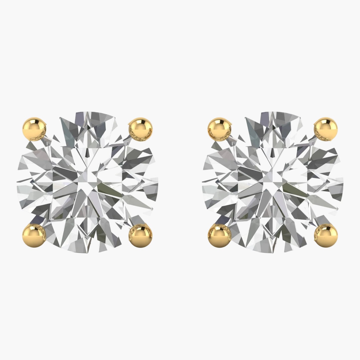 Pair of diamond stud earrings with gold prongs on a white background