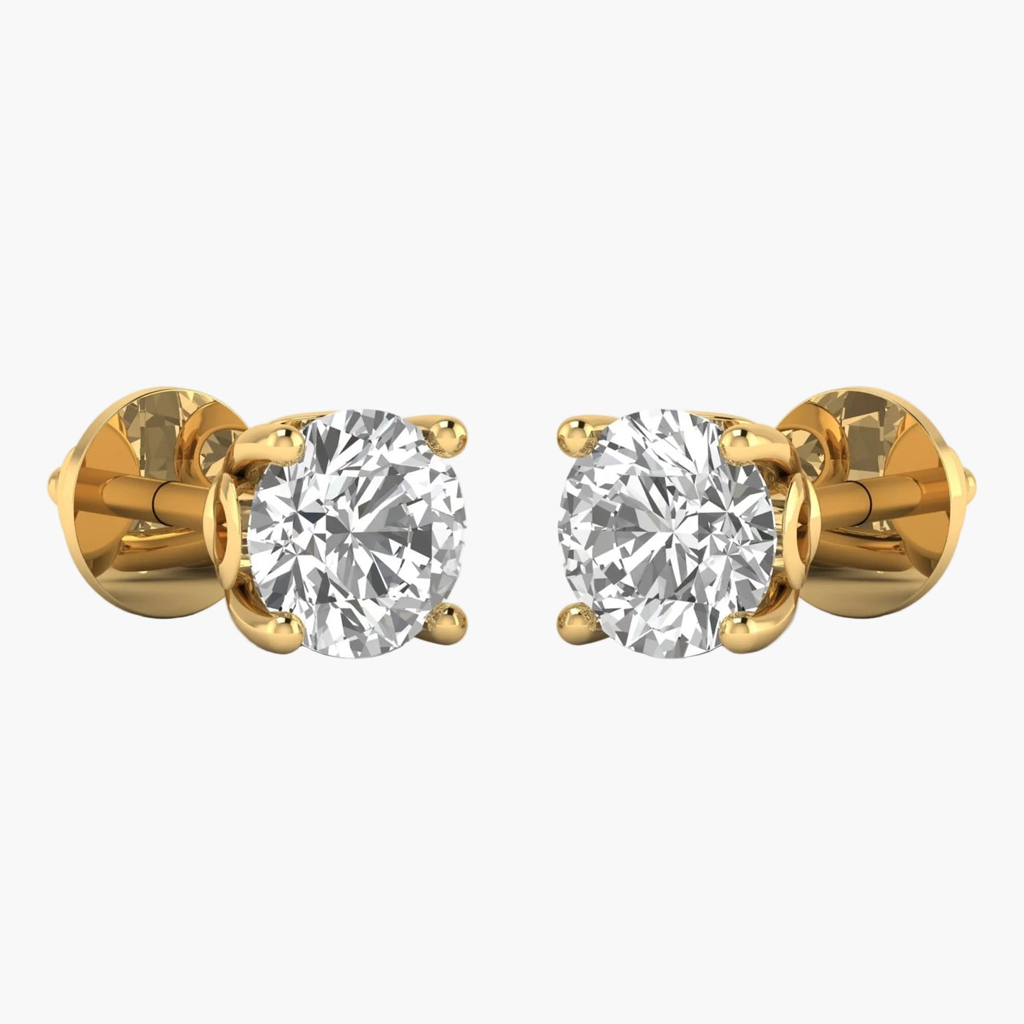 Gold earrings with clear gemstones on a white background