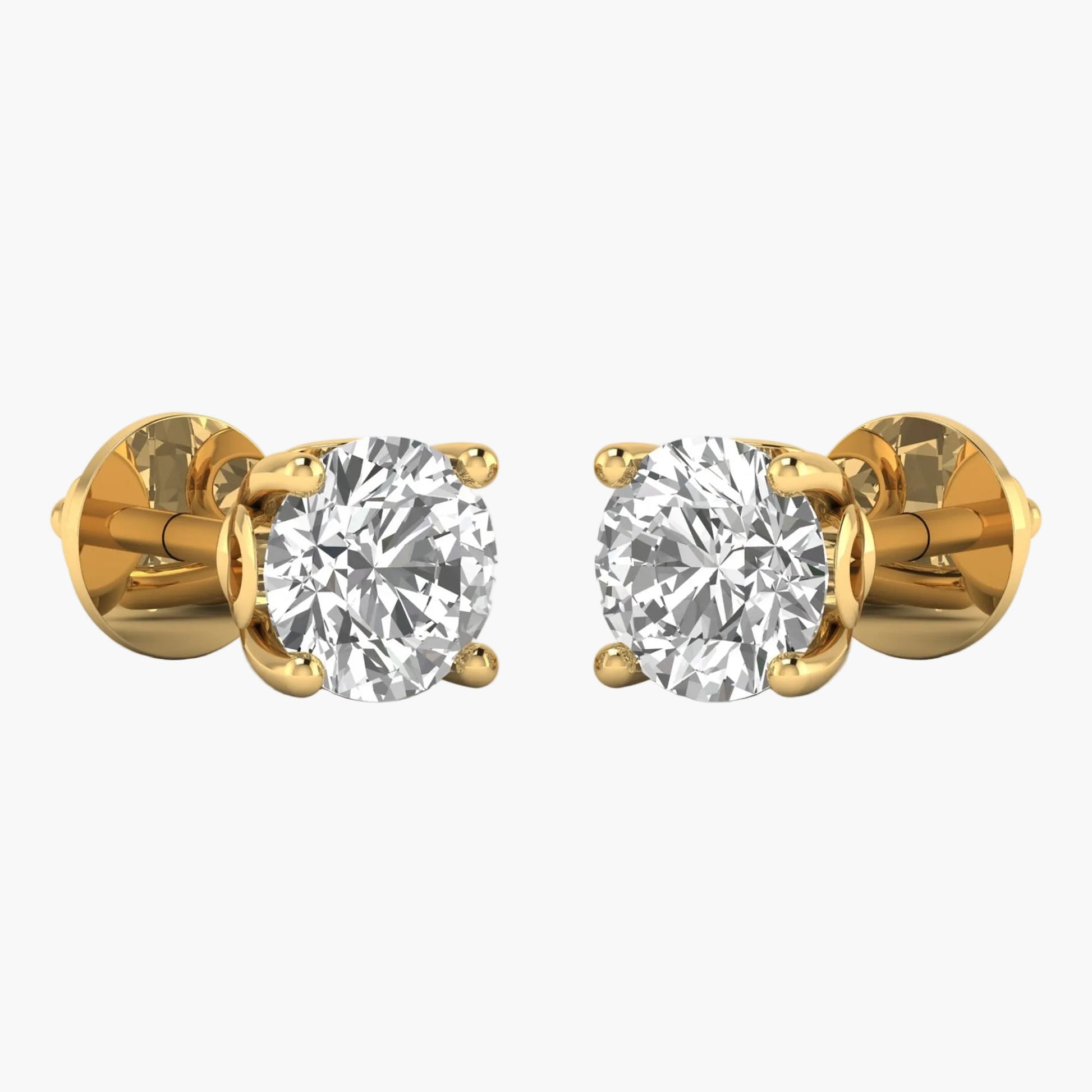 Gold earrings with clear gemstones on a white background