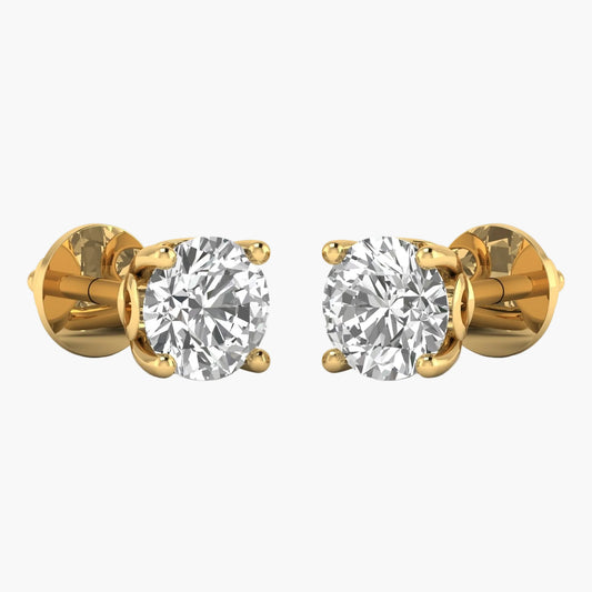 Gold earrings with clear gemstones on a white background