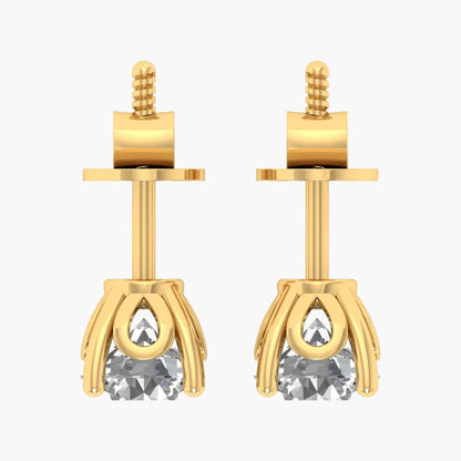 Gold earrings with clear gemstones on a white background