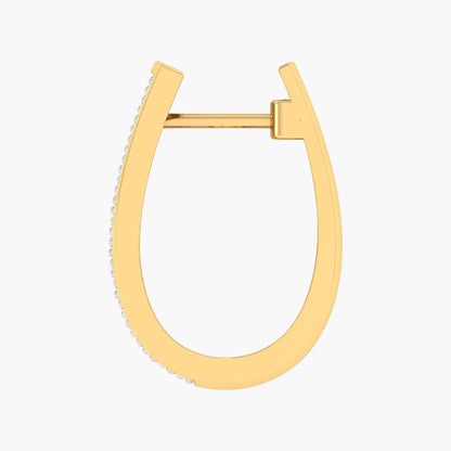 Gold hoop earring on a white background