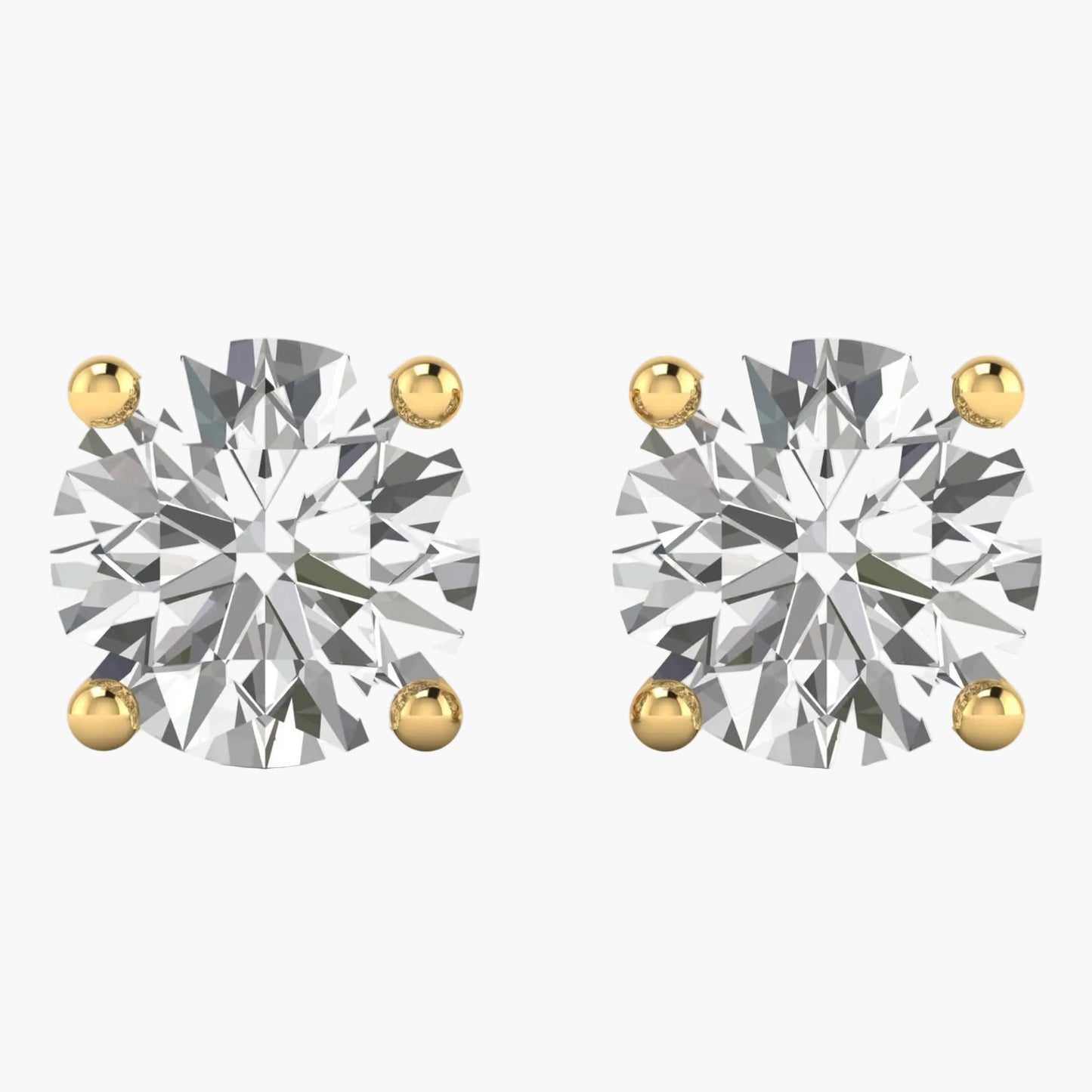 Pair of diamond stud earrings with gold prongs on a white background