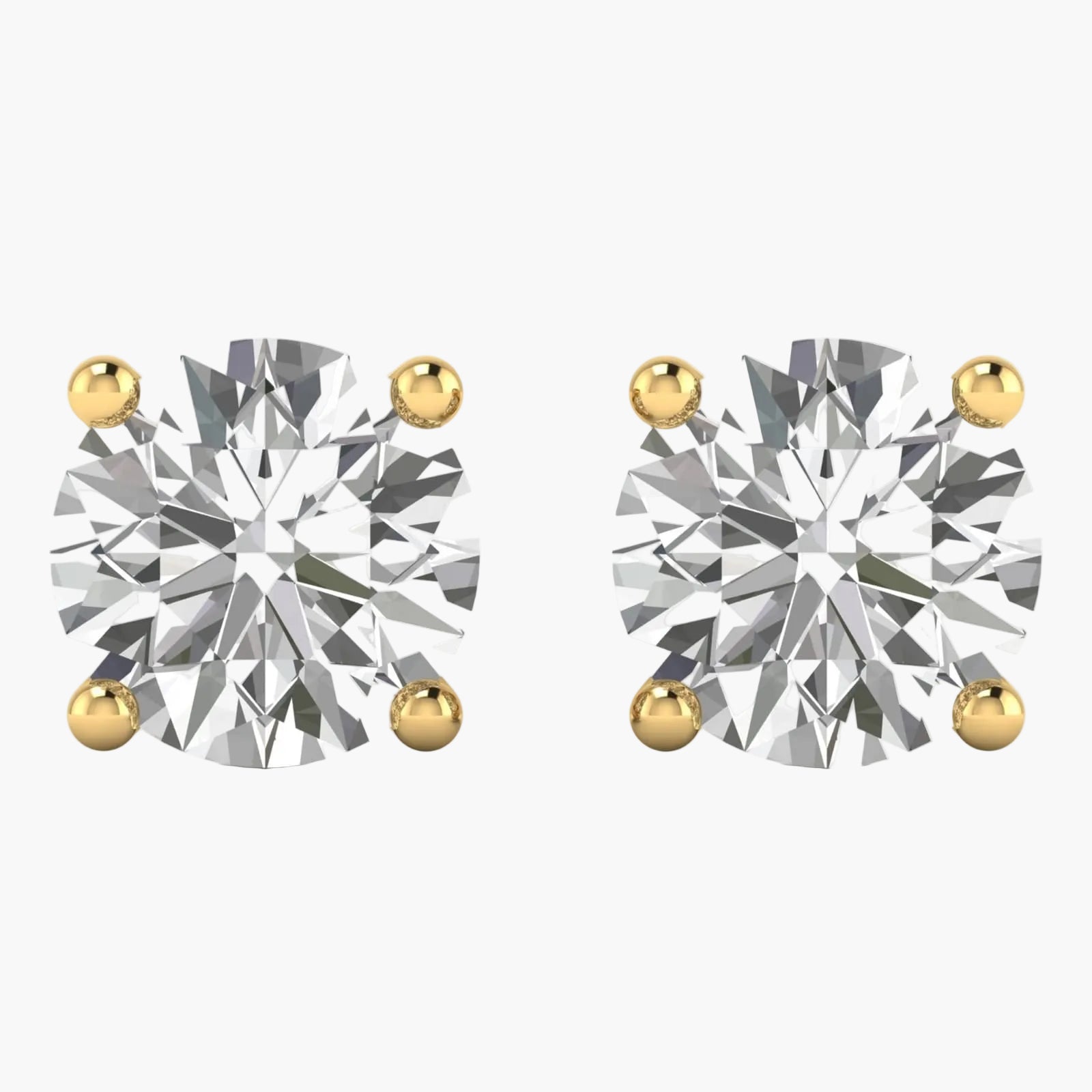 Pair of diamond stud earrings with gold prongs on a white background