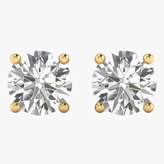 Pair of diamond stud earrings with gold prongs on a white background