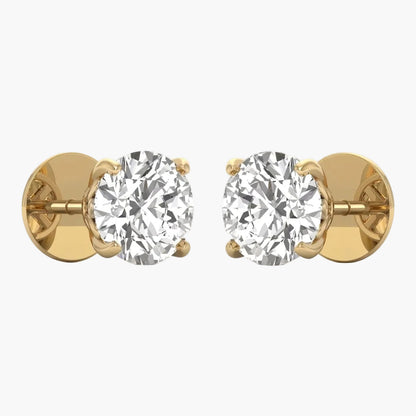 Gold earrings with clear gemstones on a white background