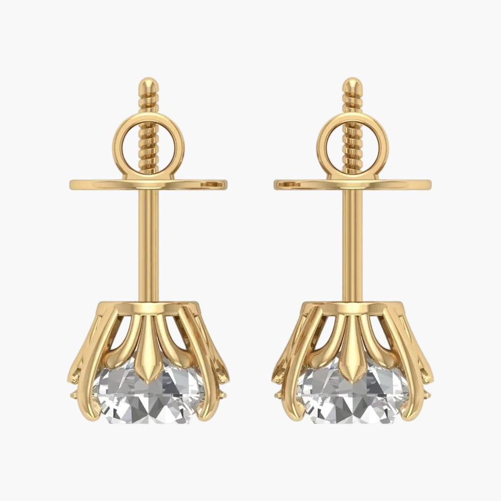 Gold earrings with clear gemstones on a white background