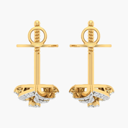 Gold anchor-shaped earrings with diamond accents on a white background
