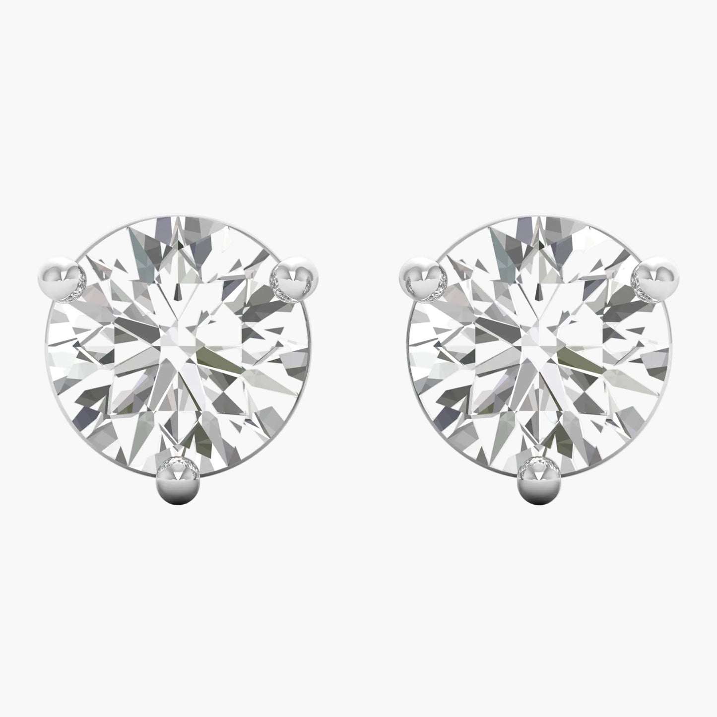 Pair of diamond stud earrings on a white background