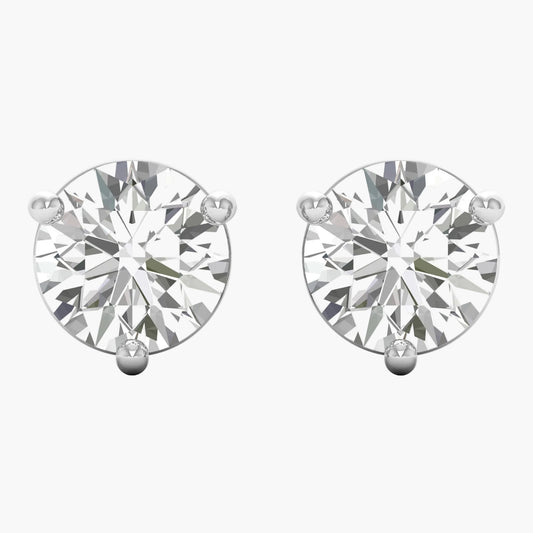 Pair of diamond stud earrings on a white background