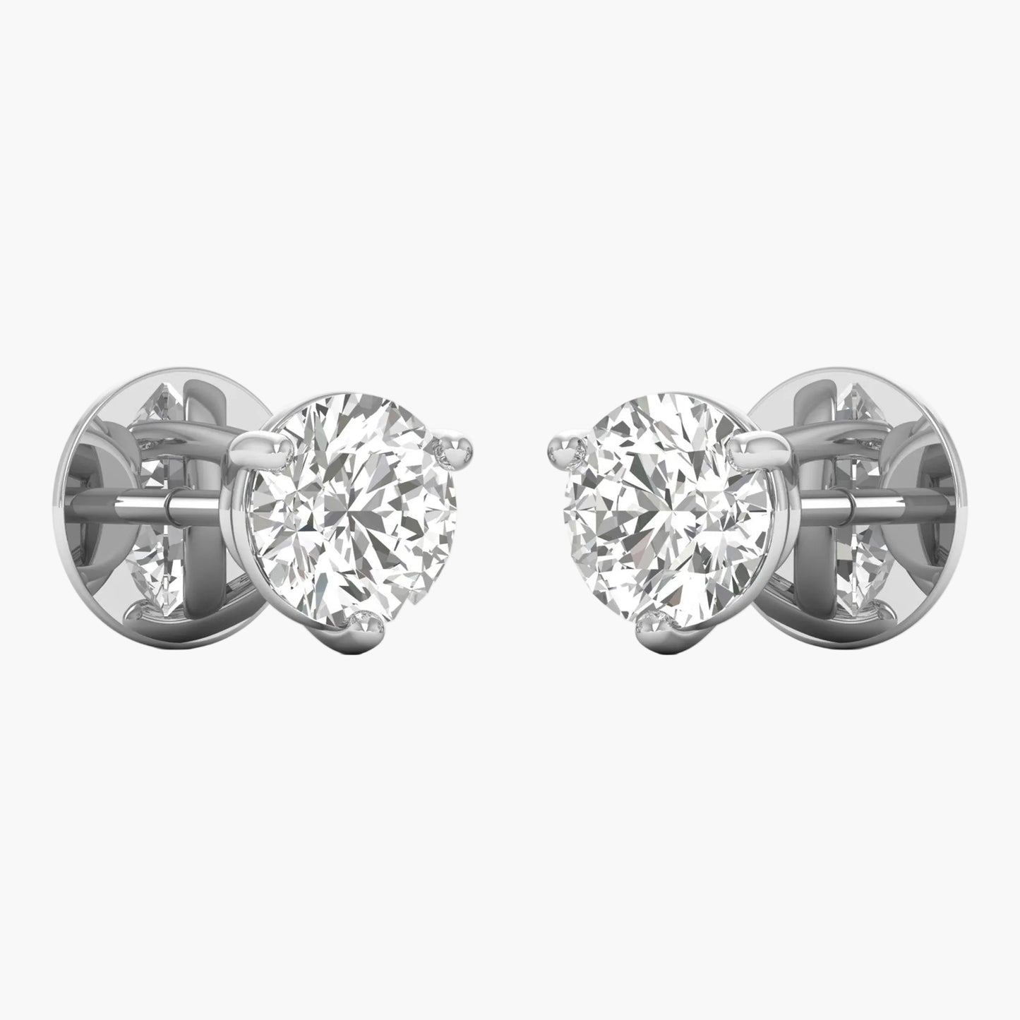 Pair of diamond stud earrings on a white background