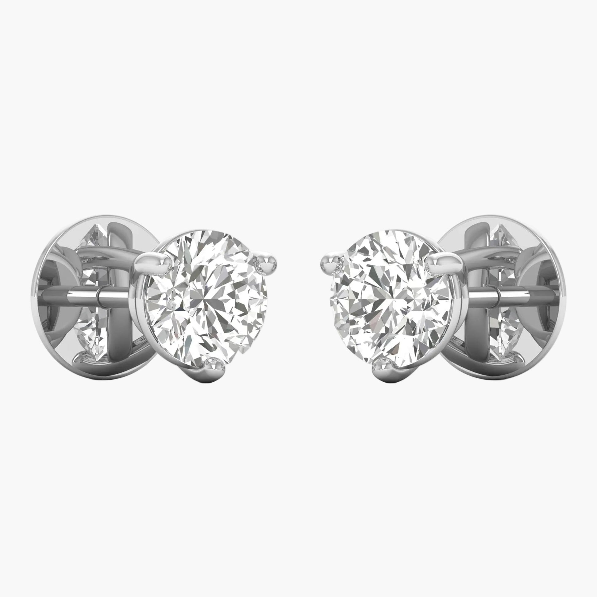 Pair of diamond stud earrings on a white background