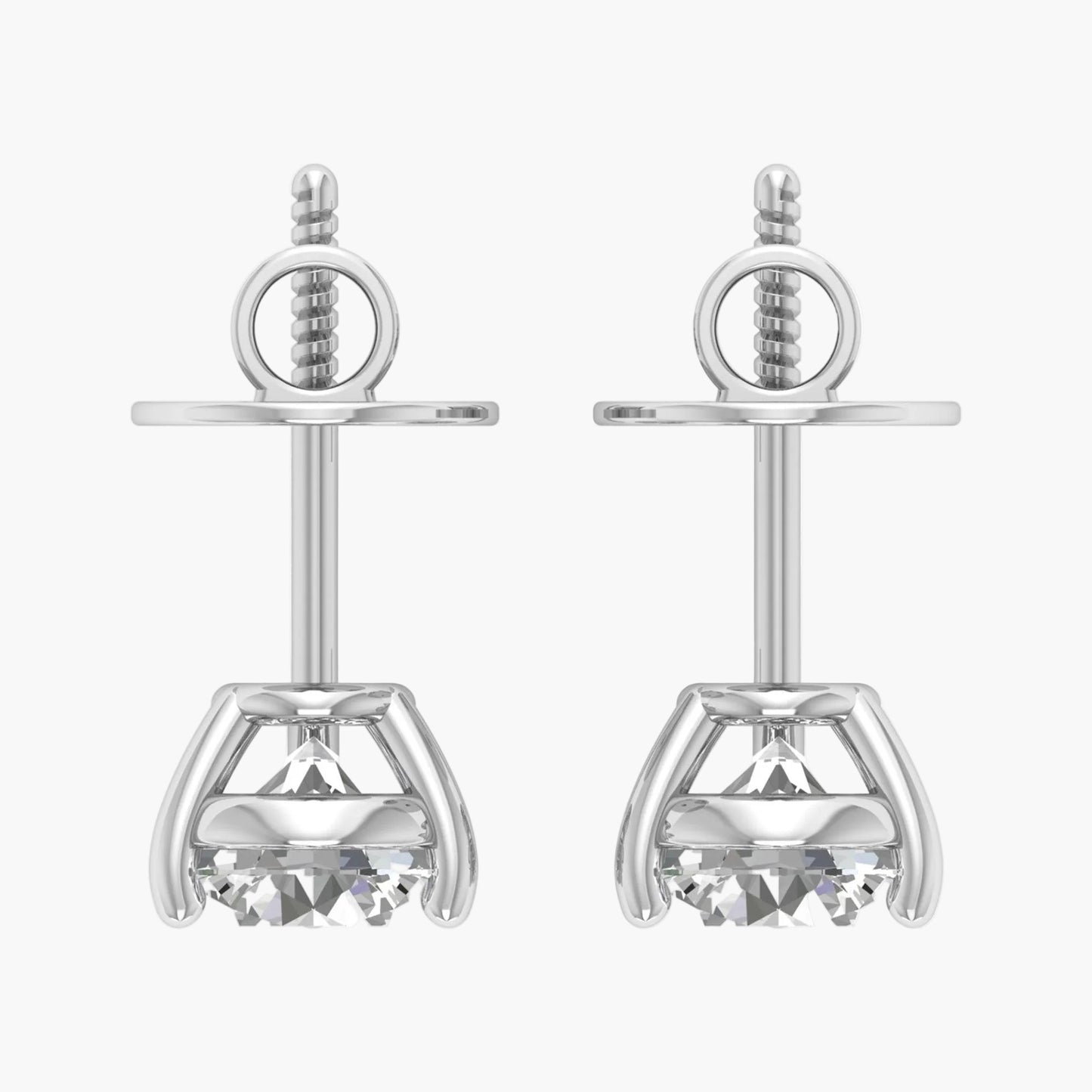 Pair of silver earrings with clear gemstones on a white background