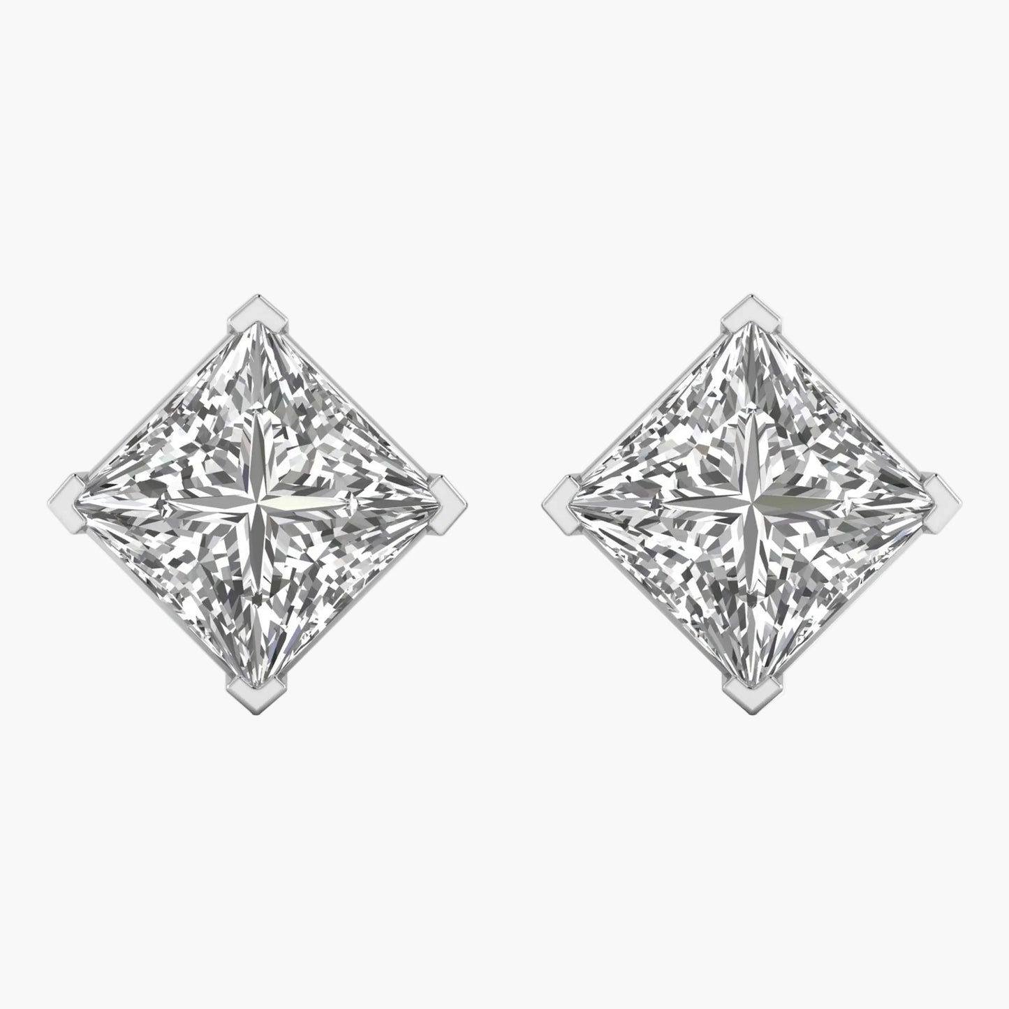 Pair of diamond stud earrings on a white background