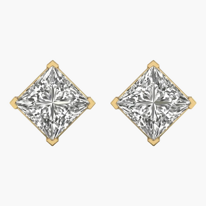 Pair of diamond earrings with gold prongs on a white background