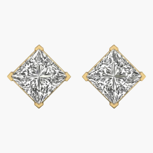 Pair of diamond earrings with gold prongs on a white background