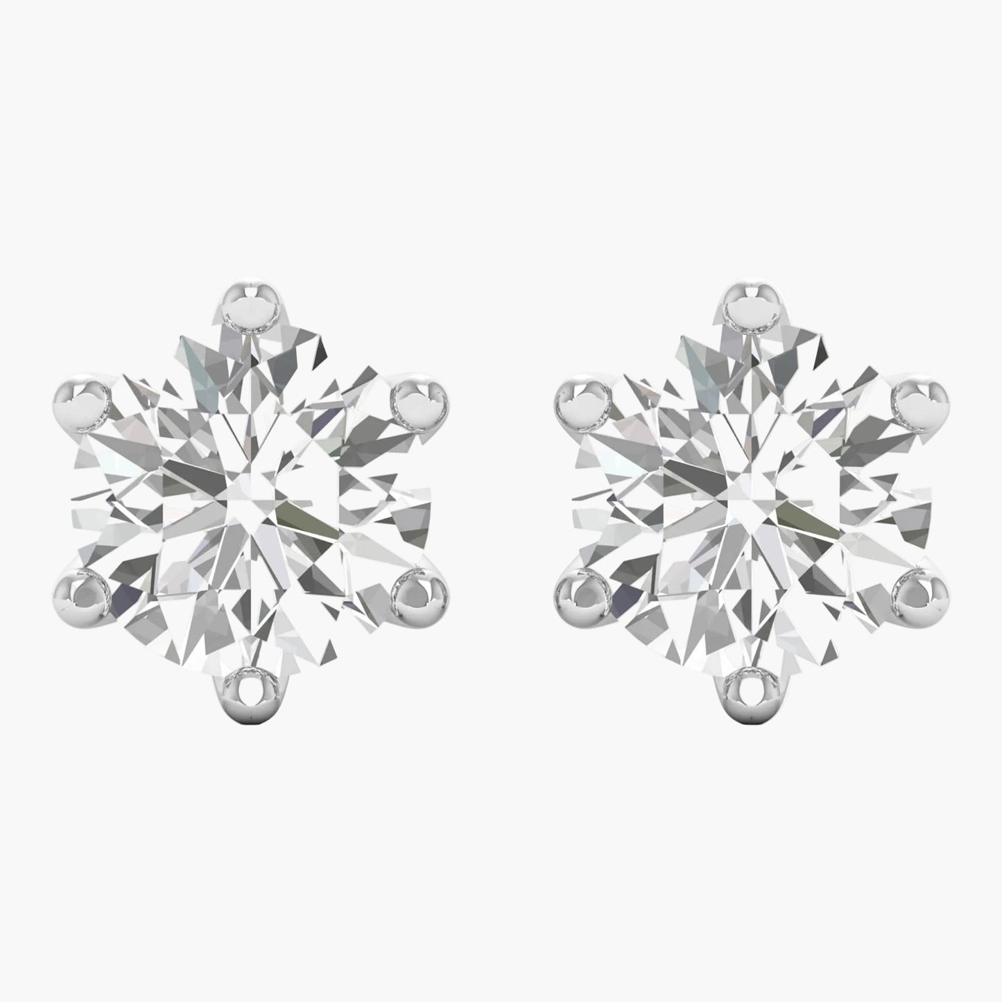Pair of diamond stud earrings on a white background