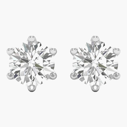 Pair of diamond stud earrings on a white background