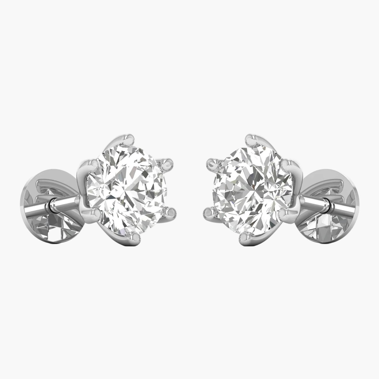 Pair of diamond stud earrings on a white background