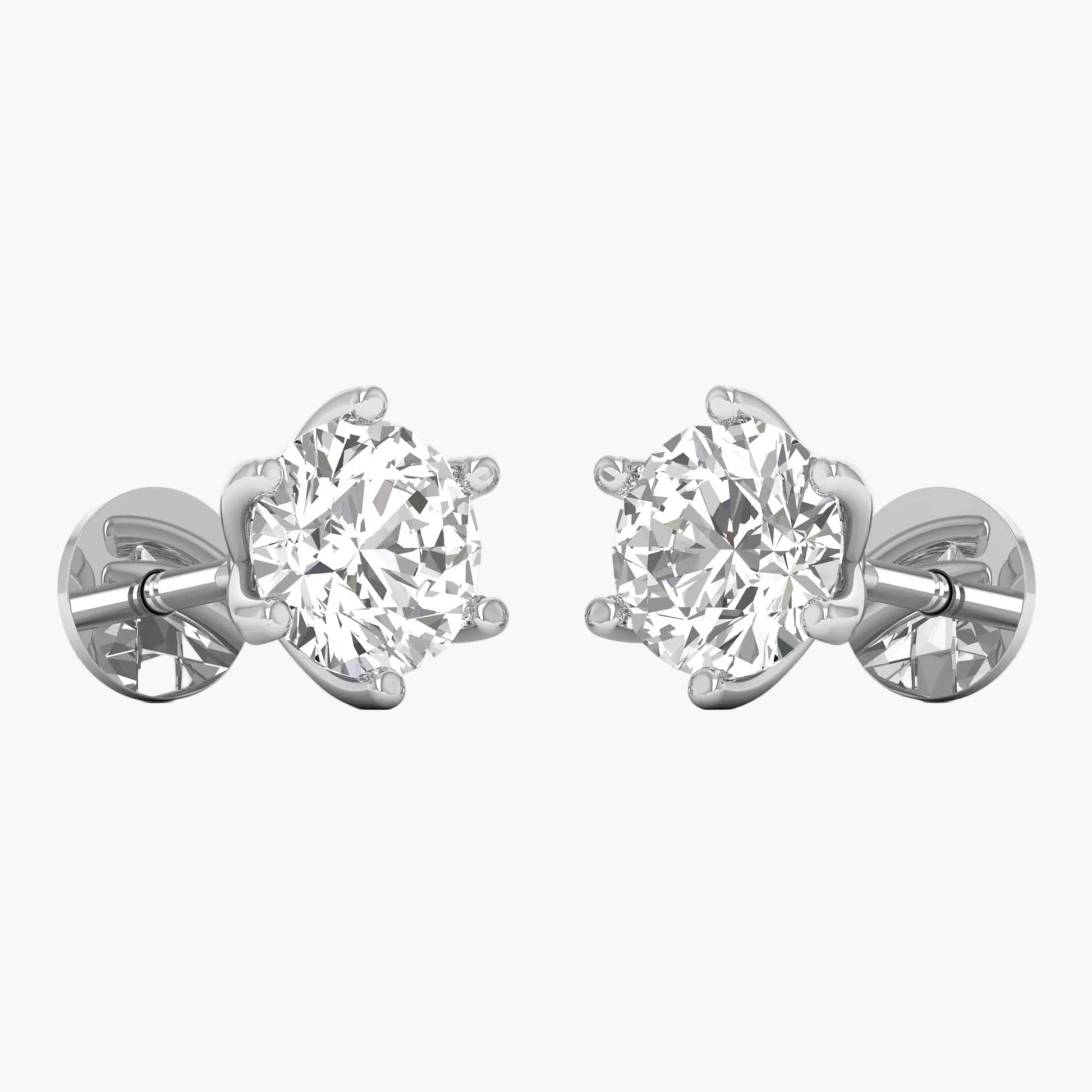 Pair of diamond stud earrings on a white background