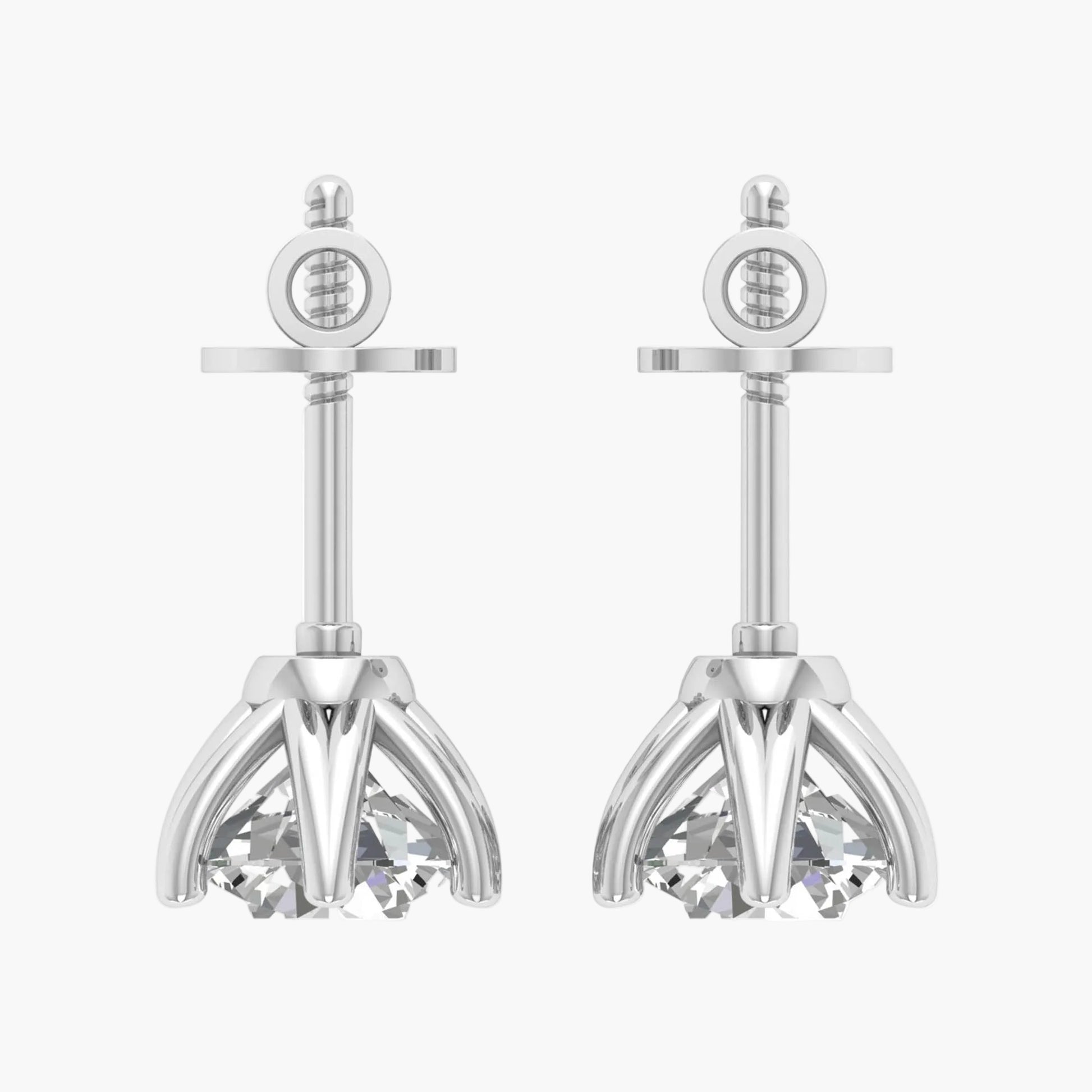 Pair of silver earrings with intricate designs on a white background