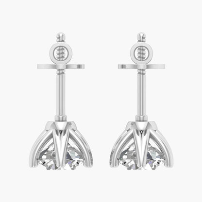 Pair of silver earrings with intricate designs on a white background