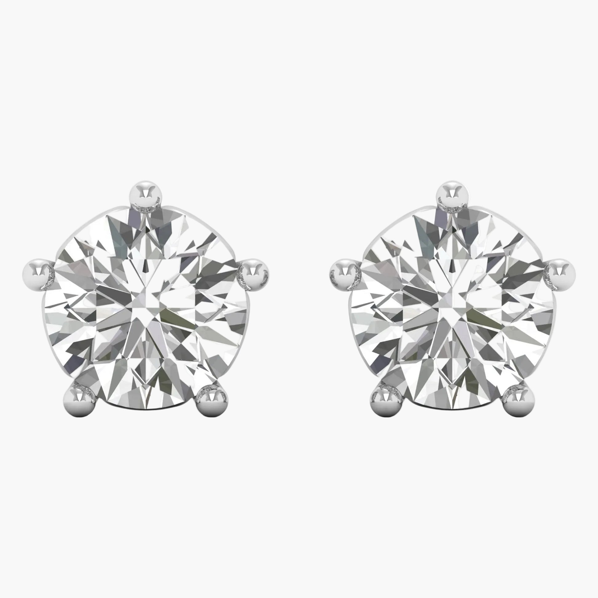 Pair of diamond stud earrings on a white background