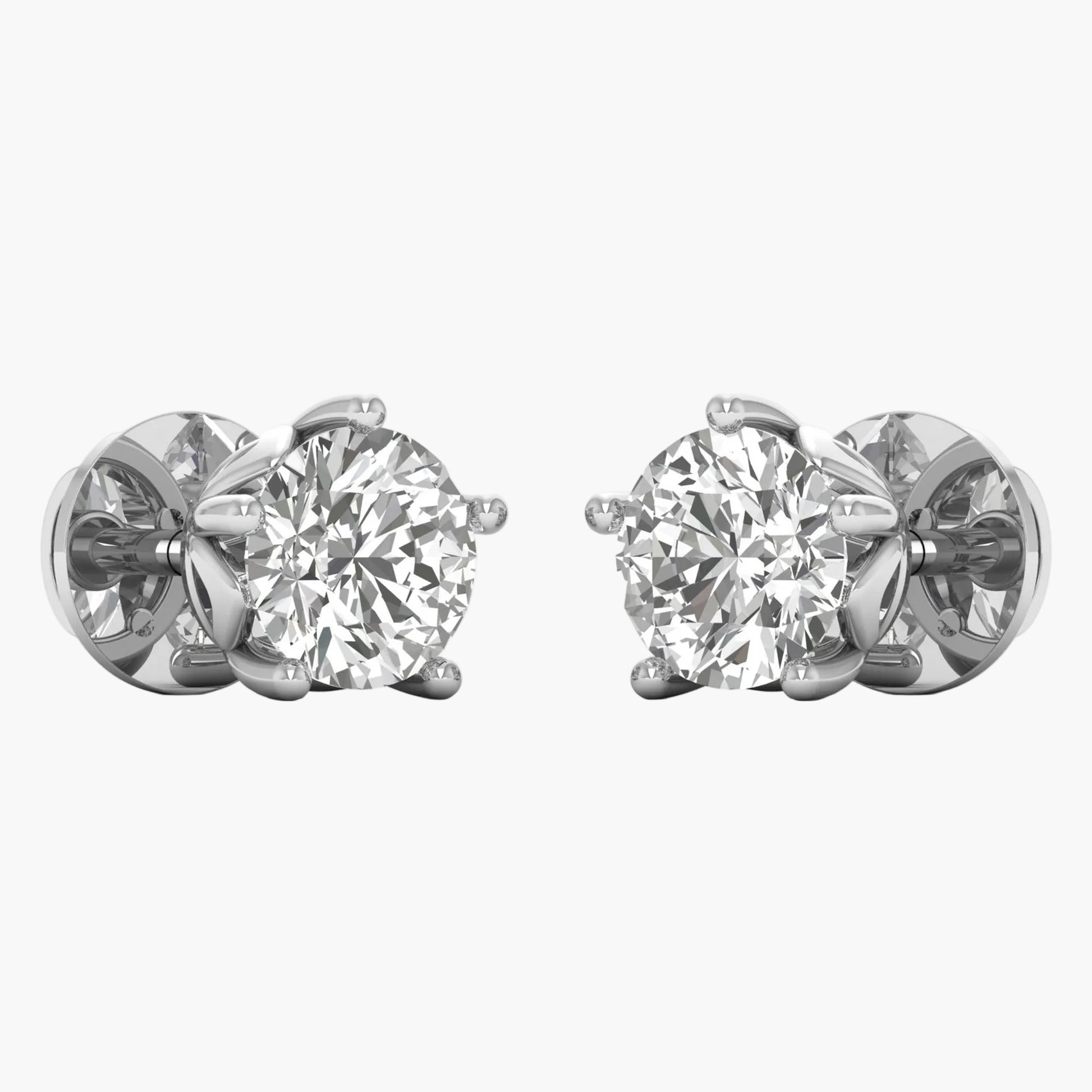 Pair of diamond stud earrings on a white background