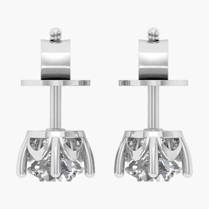 Pair of silver earrings with intricate designs on a white background
