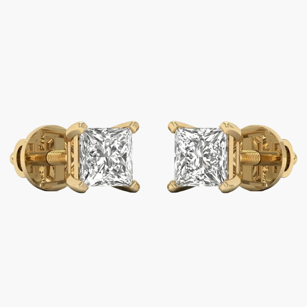 Gold earrings with clear gemstones on a white background