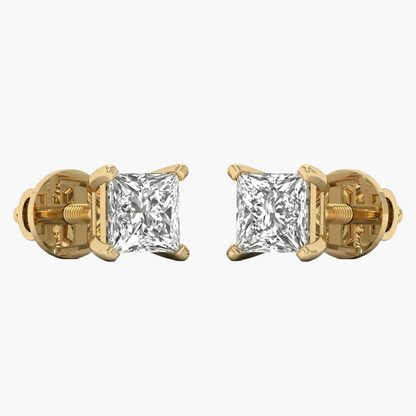 Gold earrings with clear gemstones on a white background