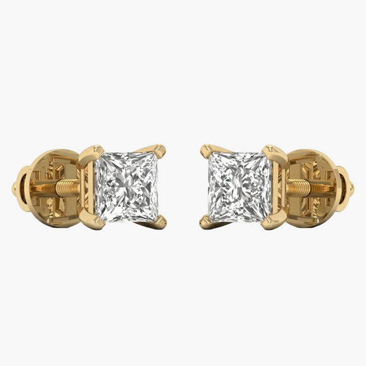 Gold earrings with clear gemstones on a white background