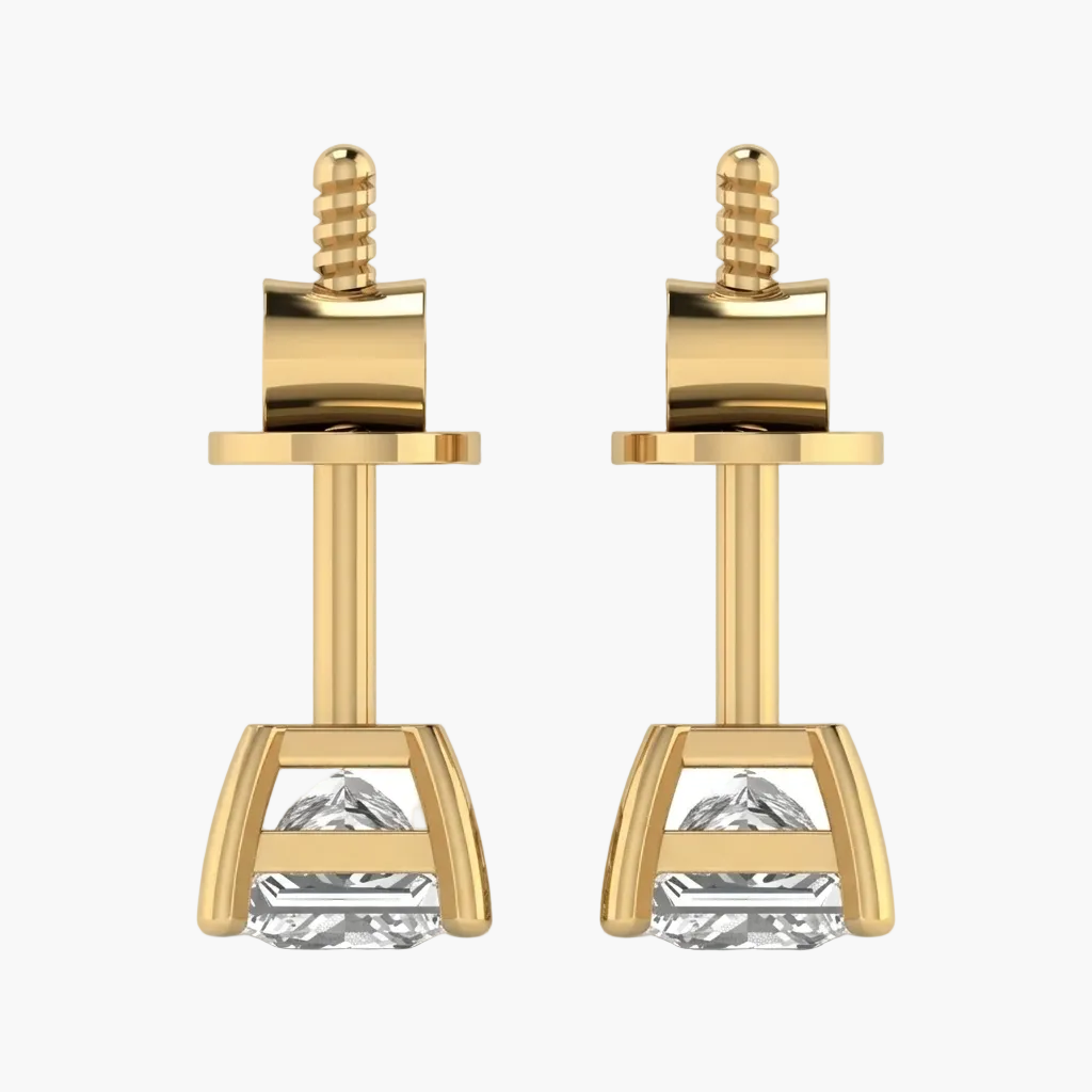 Gold earrings with clear gemstones on a white background