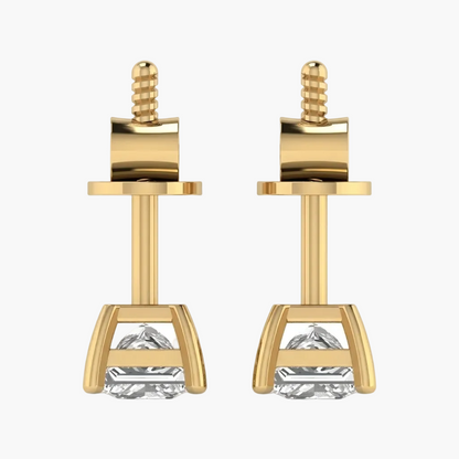Gold earrings with clear gemstones on a white background