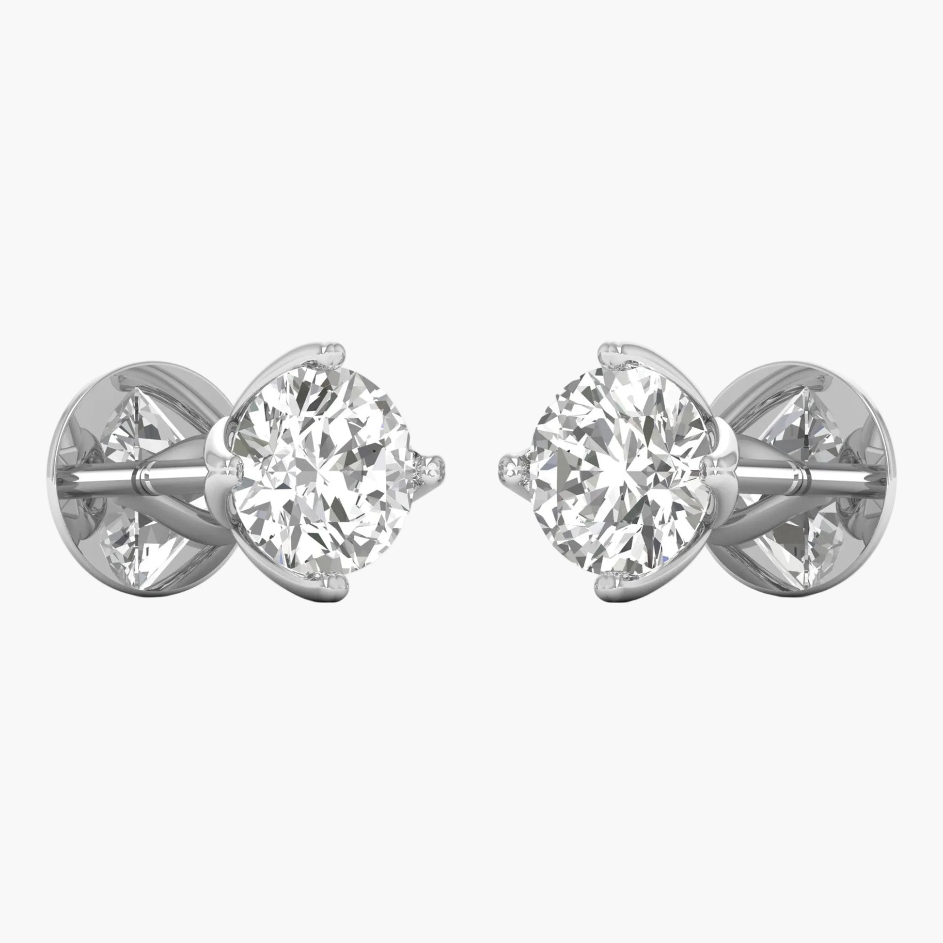 Pair of diamond stud earrings on a white background